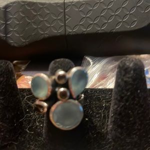 Custom ring with topaz and other stones